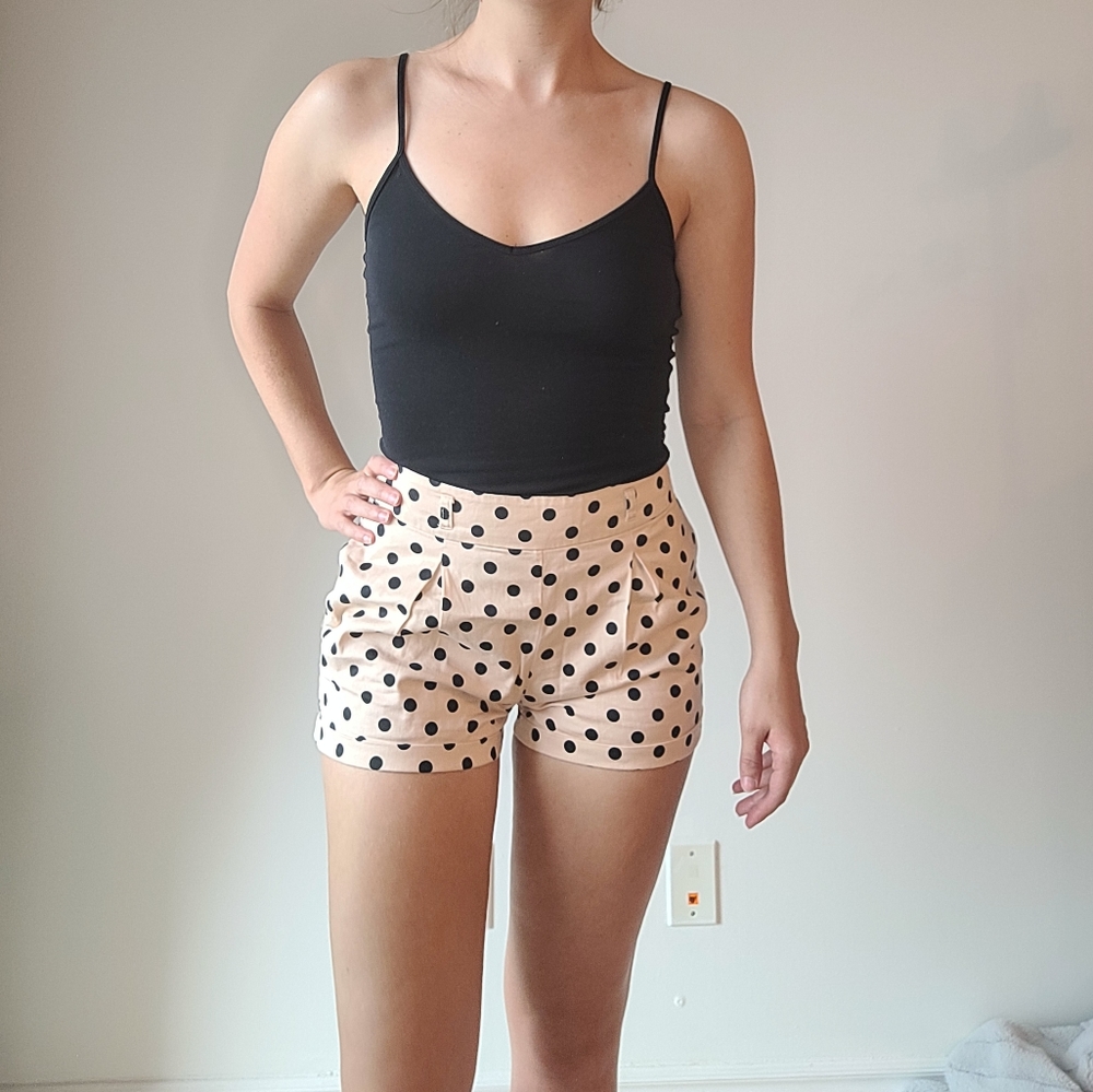 Light pink and black polka-dot high waisted shorts